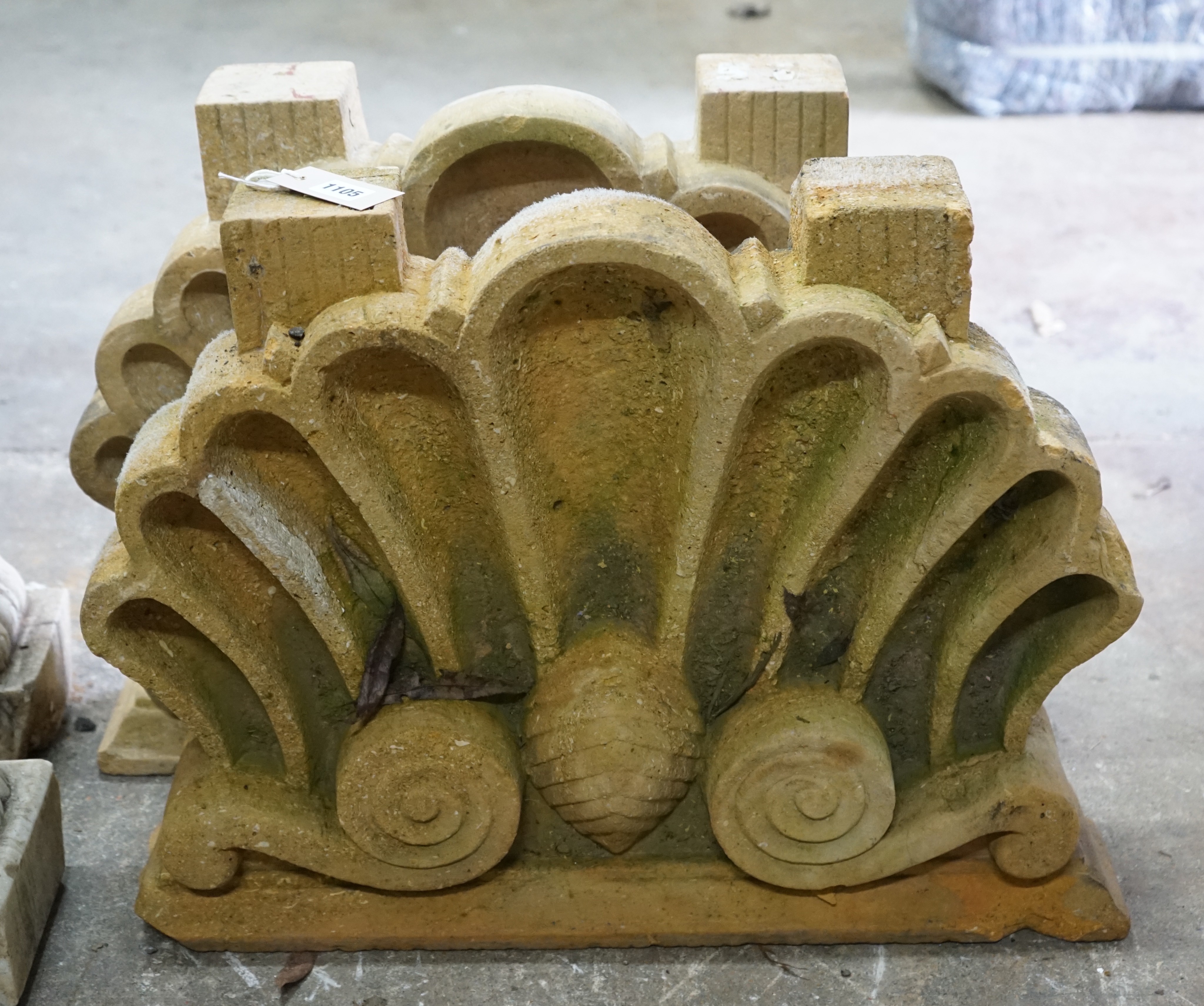 A pair of carved stone scallop shell mounts, width 60cm, height 47cm